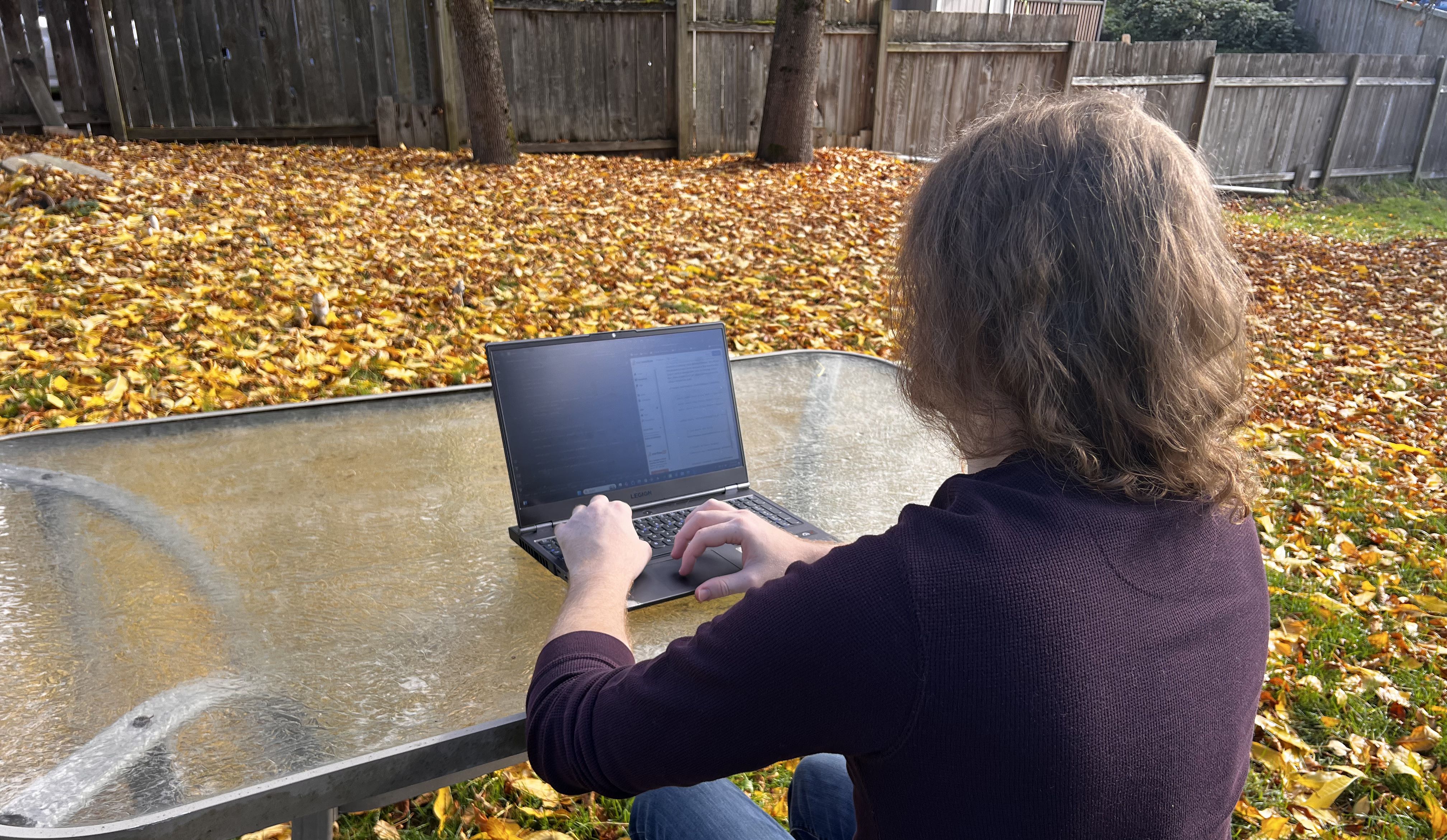 Evan working on a project on his laptop
